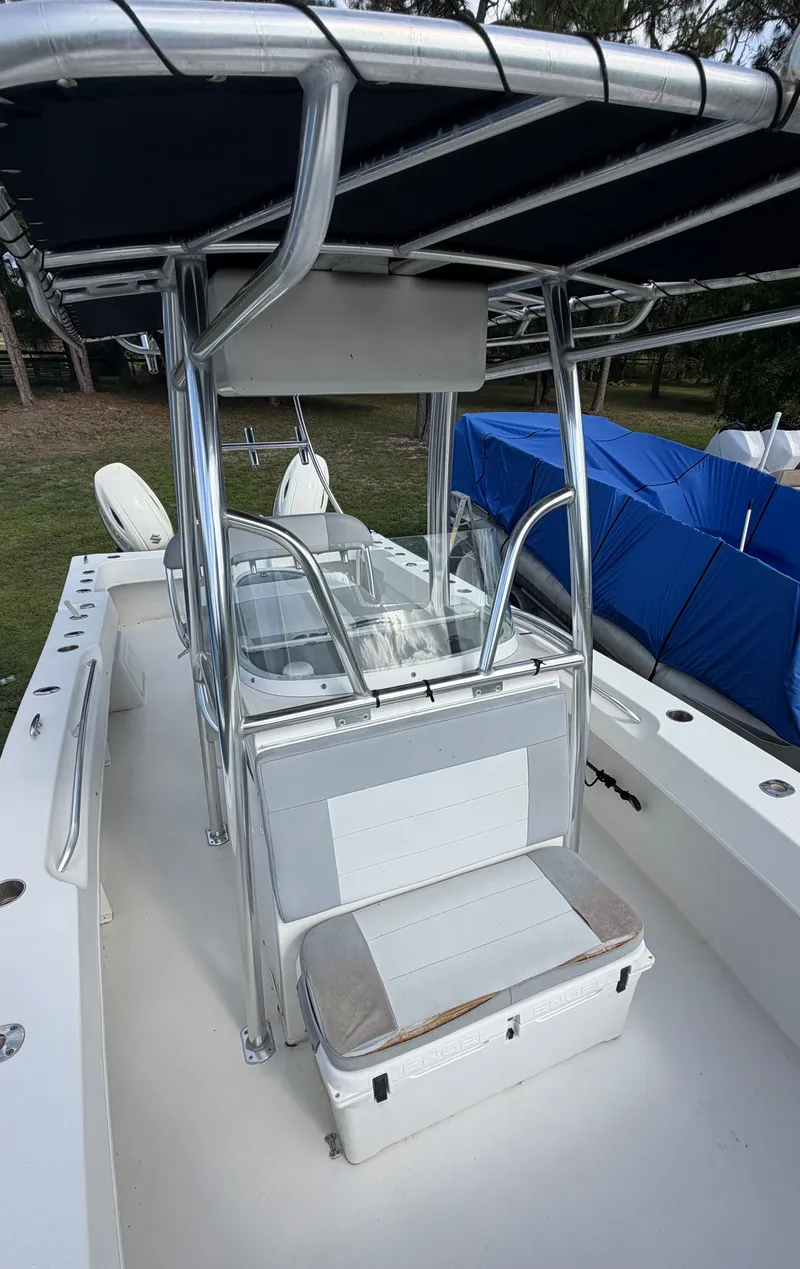 Slide: The Image of 2018 Twin Vee 260GF boat with T-top and seating bench. - 10