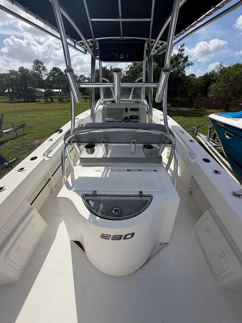 Slide: The Image of 2018 Twin Vee 260GF boat with center console and T-top. - 12