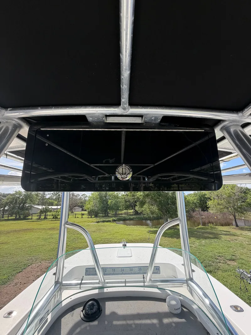 Slide: The Image of 2018 Twin Vee 260GF boat with T-top and helm console. - 13
