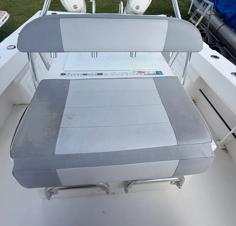 Slide: The Image of 2018 Twin Vee 260GF boat seat with gray upholstery. - 14