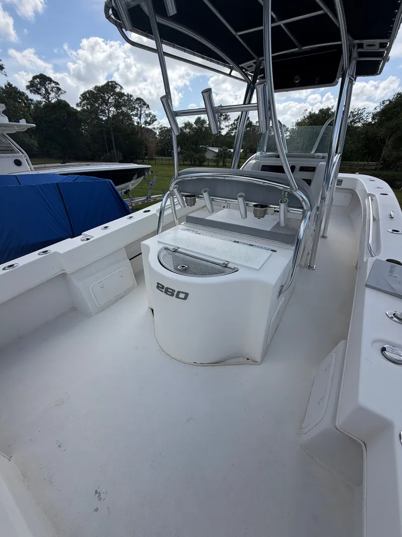 Slide: The Image of Interior view of a 2018 Twin Vee 260GF boat with T-top. - 15