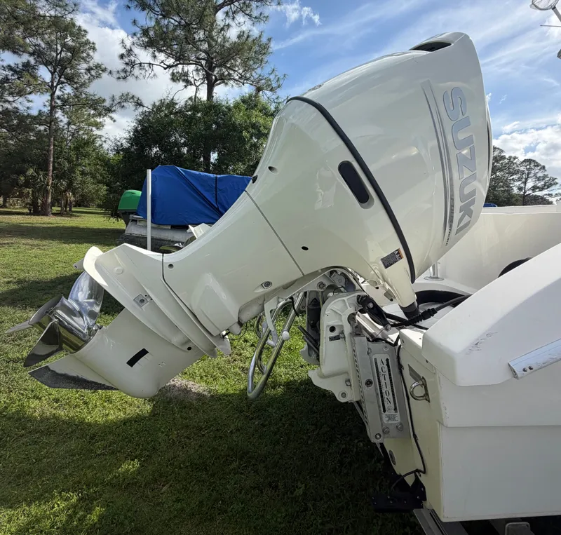 Slide: The Image of 2018 Twin Vee 260GF with Suzuki outboard motor outdoors. - 18