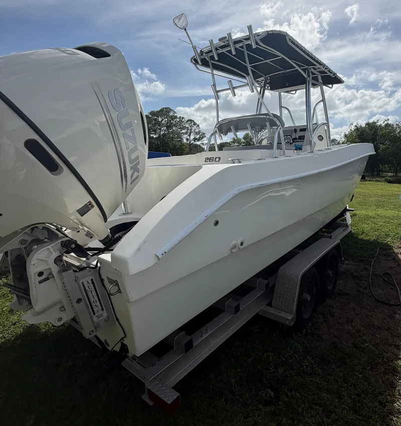 Slide: The Image of 2018 Twin Vee 260GF boat on trailer with Suzuki engine. - 2