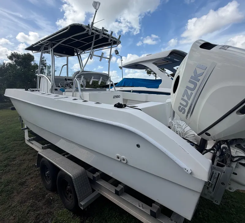 Slide: The Image of 2018 Twin Vee 260GF boat with Suzuki engine on trailer. - 3