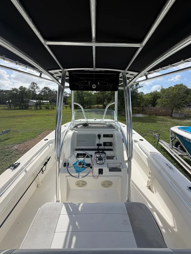 Slide: The Image of Interior view of a 2018 Twin Vee 260GF boat with helm console. - 5