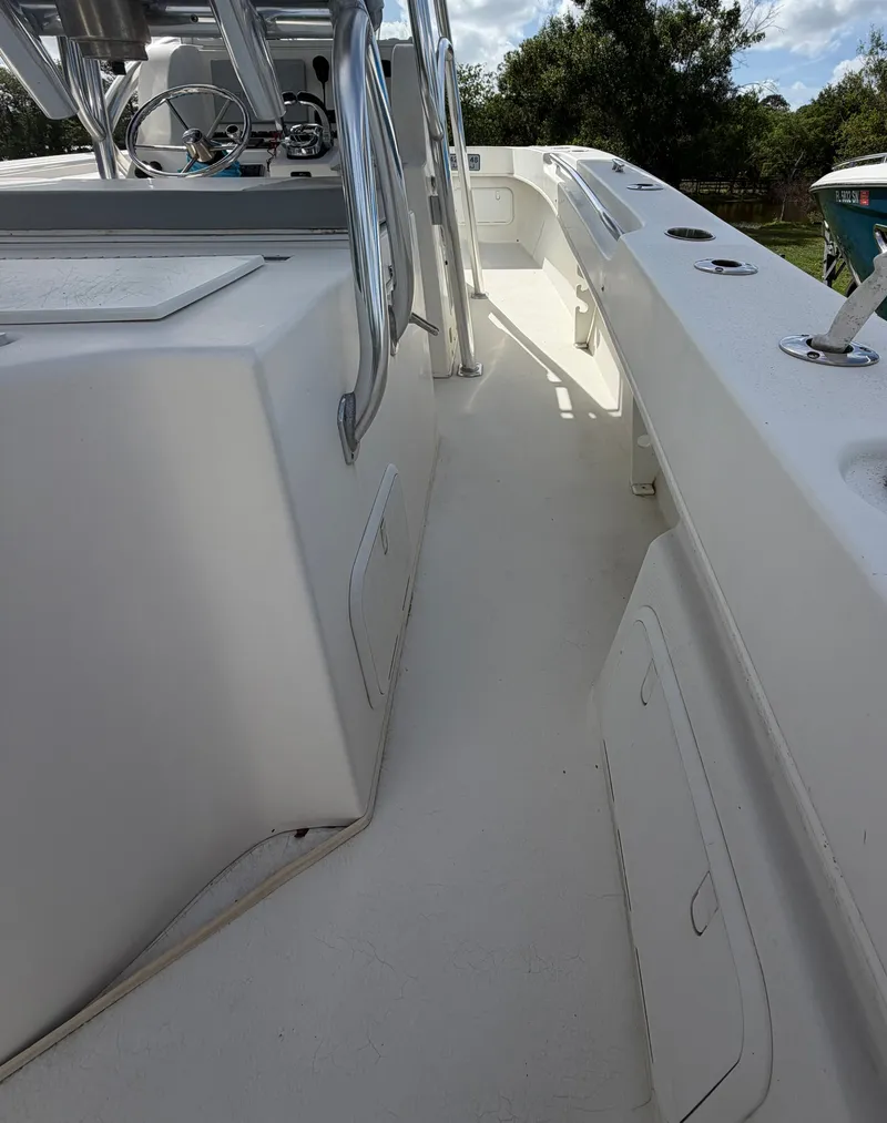Slide: The Image of Interior view of a 2018 Twin Vee 260GF boat, white surface. - 6