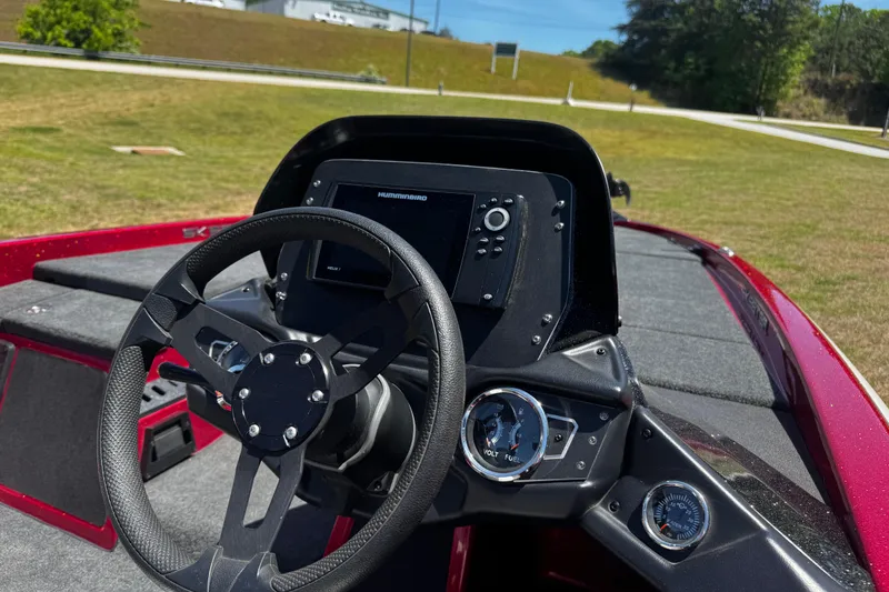 Slide: The Image of 2019 Skeeter ZX200 boat dashboard with steering wheel and electronic display. - 13