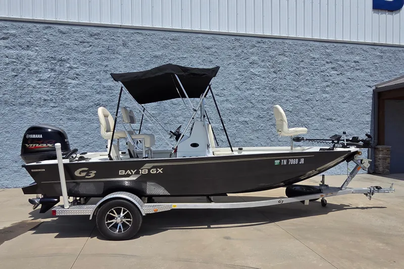 The Image of 2022 G3 Bay 18 GX boat on trailer with Yamaha engine, parked outdoors. - 1