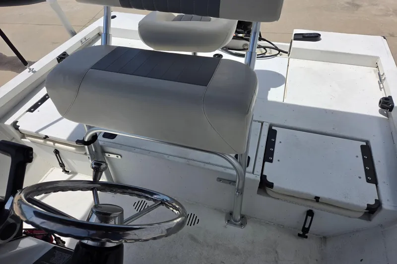 Slide: The Image of 2022 G3 Bay 18 GX boat interior with steering wheel and seating. - 14