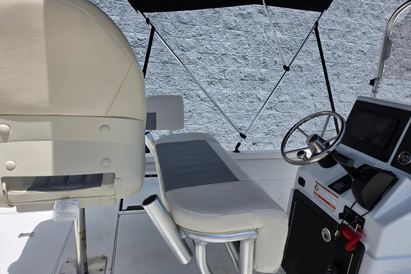 Slide: The Image of 2022 G3 Bay 18 GX boat interior with steering wheel and seating. - 16