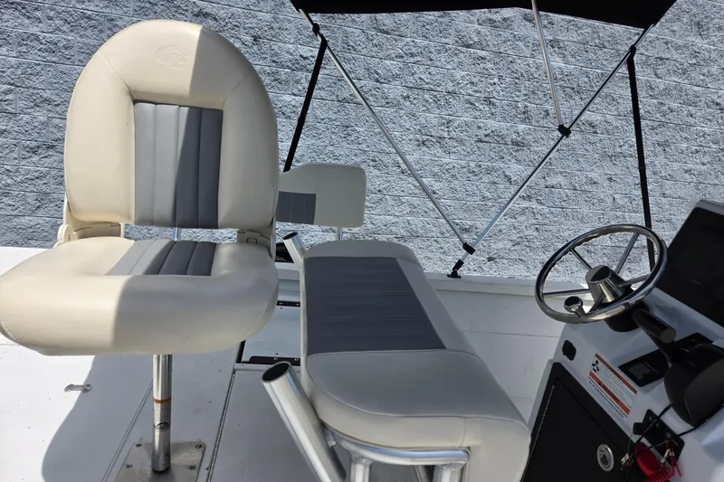 Slide: The Image of 2022 G3 Bay 18 GX boat interior with steering wheel and seating. - 17