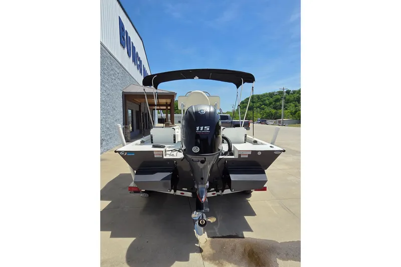 Slide: The Image of 2022 G3 Bay 18 GX boat with Yamaha 115 outboard motor, parked outdoors. - 4