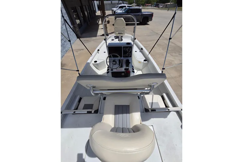 Slide: The Image of 2022 G3 Bay 18 GX boat interior with steering console and seating. - 5