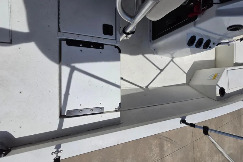Slide: The Image of 2022 G3 Bay 18 GX boat interior with storage compartments and seating area. - 7