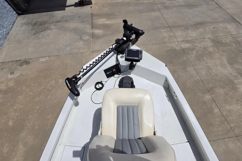 Slide: The Image of 2022 G3 Bay 18 GX boat with trolling motor and seat on concrete surface. - 9