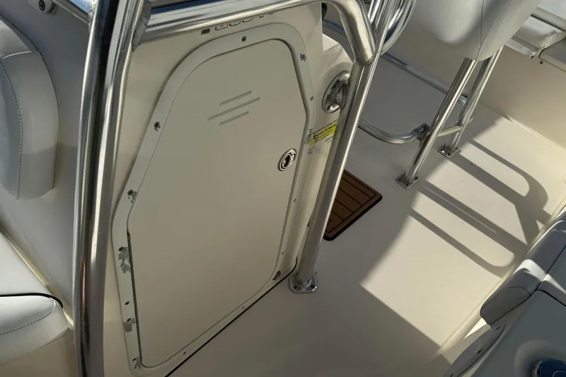 Slide: The Image of 2014 Key West 203 FS boat interior with seating and storage compartment. - 11