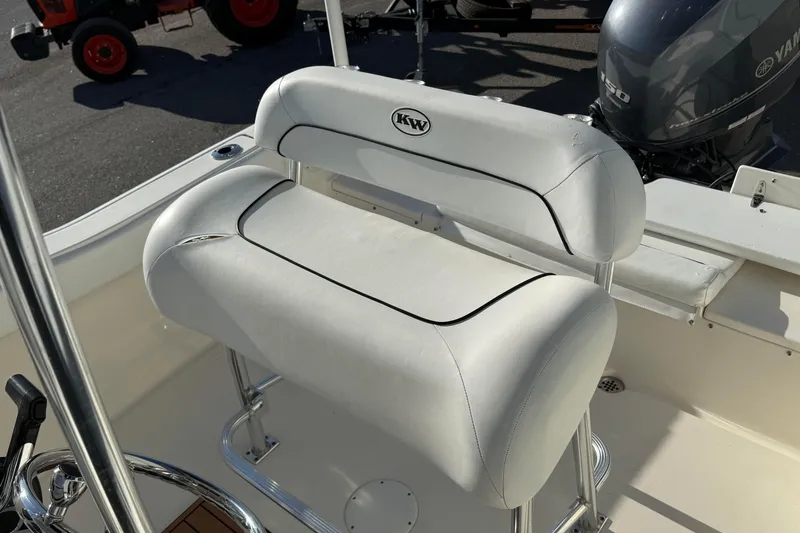 Slide: The Image of 2014 Key West 203 FS boat seat with Yamaha engine in background. - 14