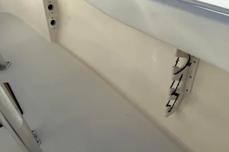 Slide: The Image of Interior view of a 2014 Key West 203 FS boat, showcasing seating and fixtures. - 17