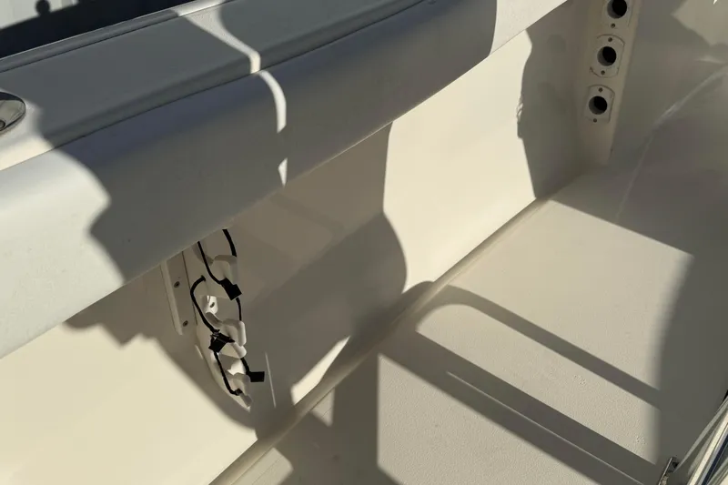 Slide: The Image of Interior view of a 2014 Key West 203 FS boat, showing seating and rod holders. - 18