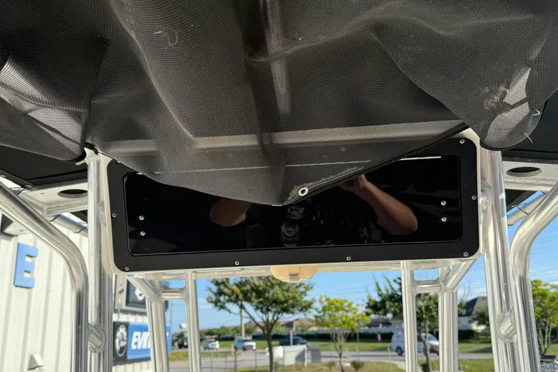 Slide: The Image of 2014 Key West 203 FS boat canopy and console detail with outdoor background. - 19