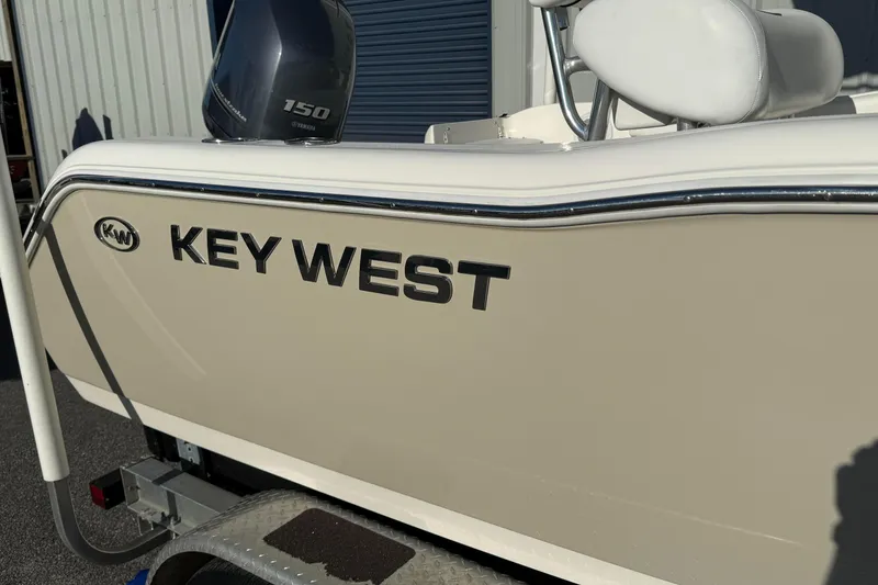 Slide: The Image of 2014 Key West 203 FS boat with Yamaha 150 engine on trailer. - 2