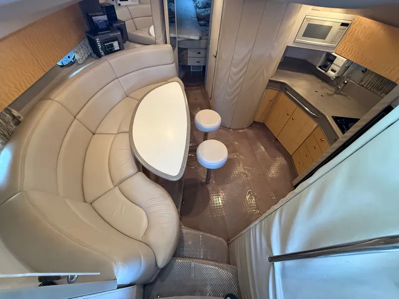 Slide: The Image of Interior of a 1999 Formula 41 Performance Cruiser with kitchen and seating area. - 14
