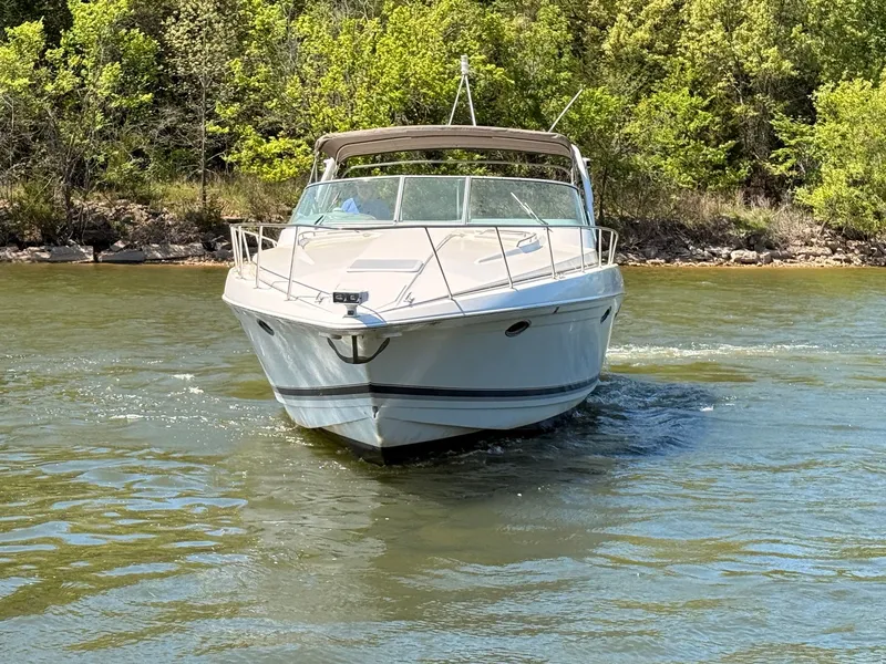 Slide: The Image of 1999 Formula 41 Performance Cruiser on a tranquil lake. - 2