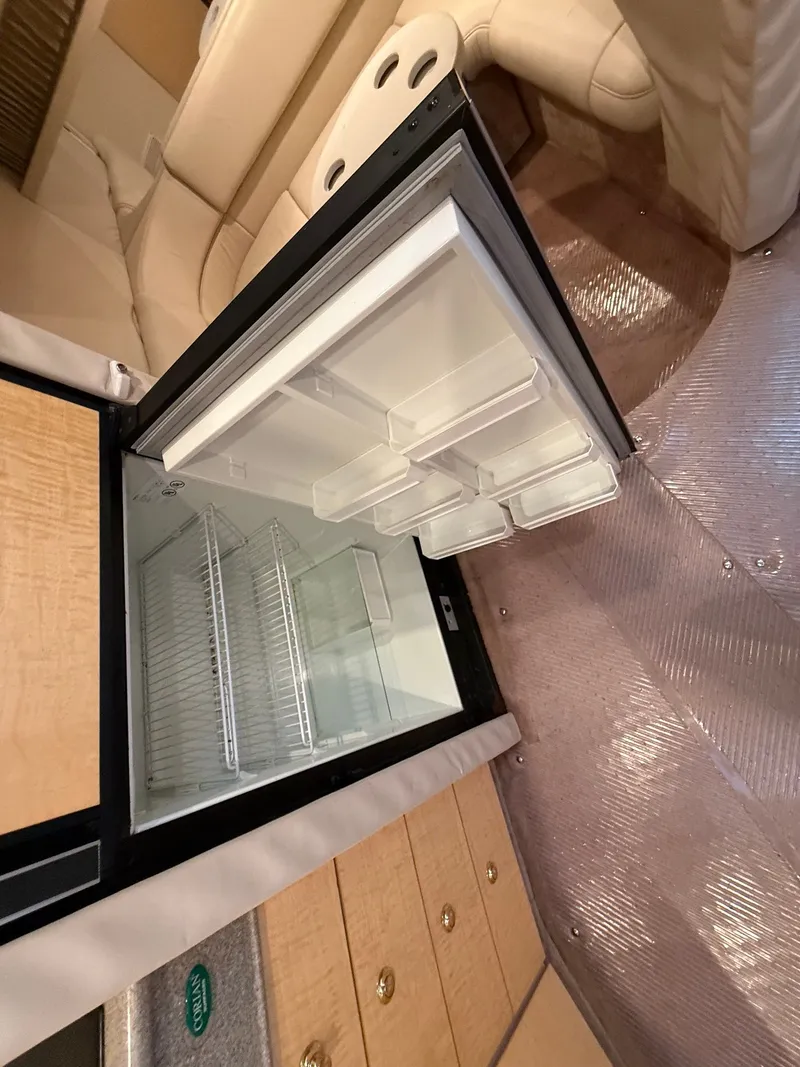 Slide: The Image of Open fridge inside a 1999 Formula 41 Performance Cruiser. - 20