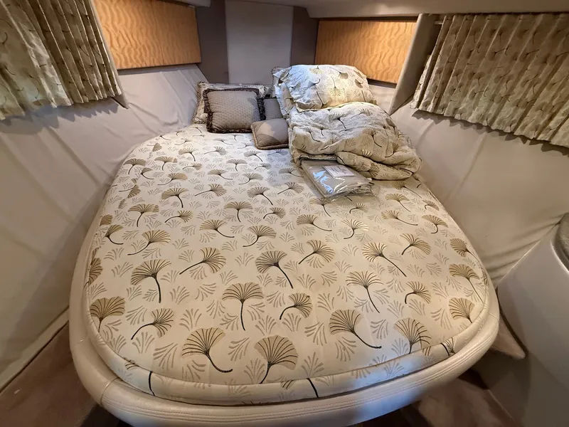 Slide: The Image of Interior of a 1999 Formula 41 Performance Cruiser with cozy bed. - 21