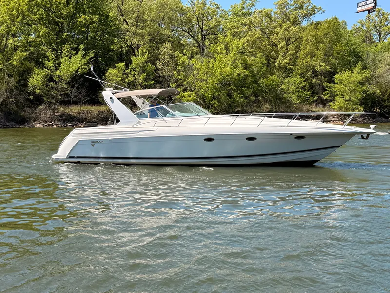 Slide: The Image of 1999 Formula 41 Performance Cruiser on a river. - 6