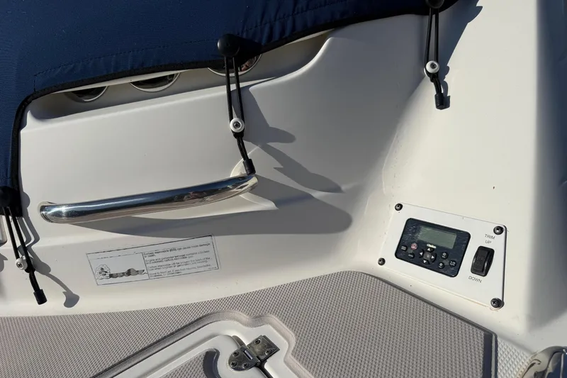 Slide: The Image of Control panel and handle on a 2005 Chaparral 236 SSi boat deck. - 10