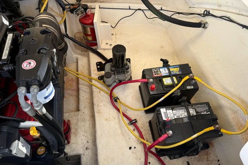 Slide: The Image of Engine compartment of a 2005 Chaparral 236 SSi with batteries and fire extinguisher. - 17