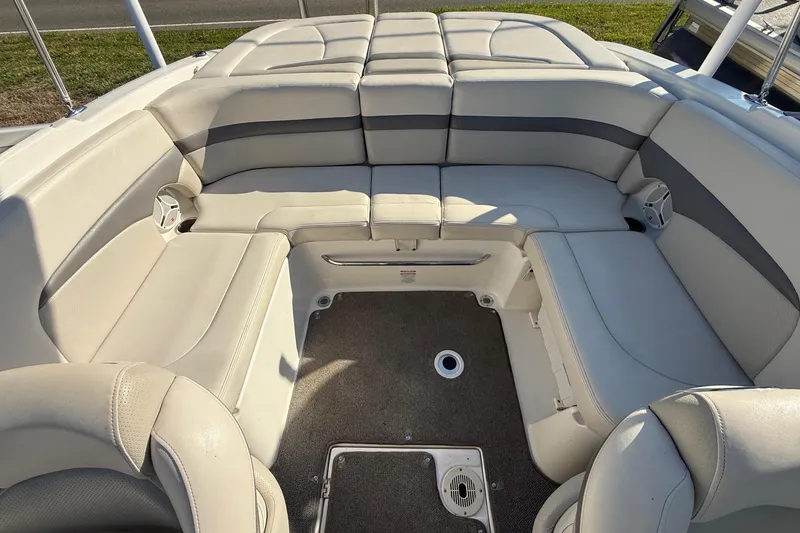 Slide: The Image of 2005 Chaparral 236 SSi boat interior with spacious seating and carpeted flooring. - 21