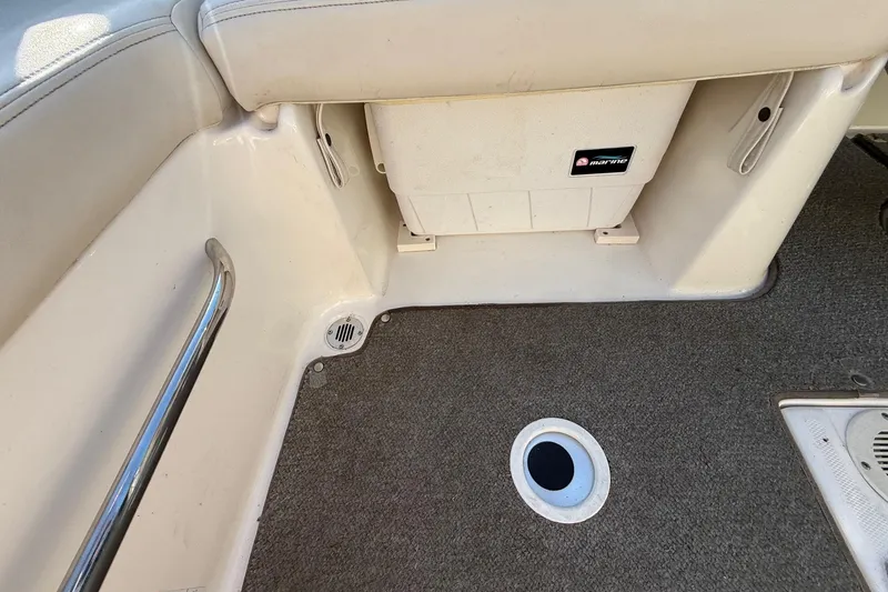 Slide: The Image of Interior of a 2005 Chaparral 236 SSi boat showing seating and carpeted floor. - 25
