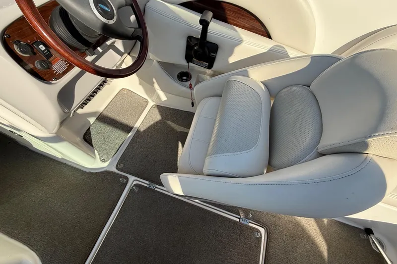 Slide: The Image of Interior of 2005 Chaparral 236 SSi boat with steering wheel and seat. - 30