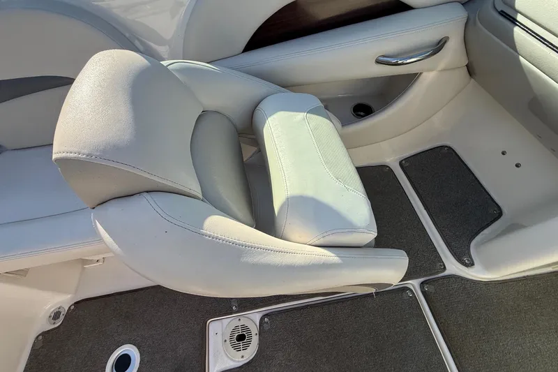 Slide: The Image of 2005 Chaparral 236 SSi boat interior with gray seating and carpeted flooring. - 31