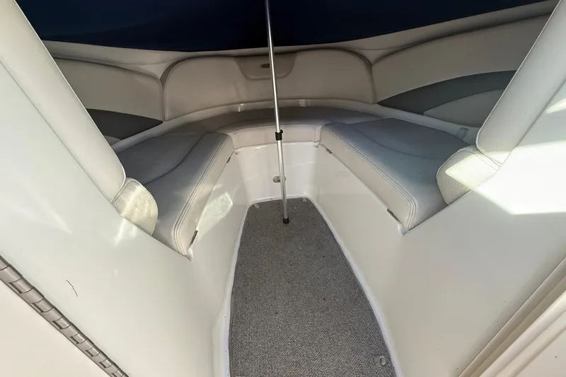 Slide: The Image of Interior of 2005 Chaparral 236 SSi boat with cushioned seating and carpeted floor. - 35