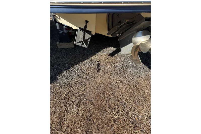 Slide: The Image of Rear view of 2005 Chaparral 236 SSi boat showing propeller and trim tabs. - 37