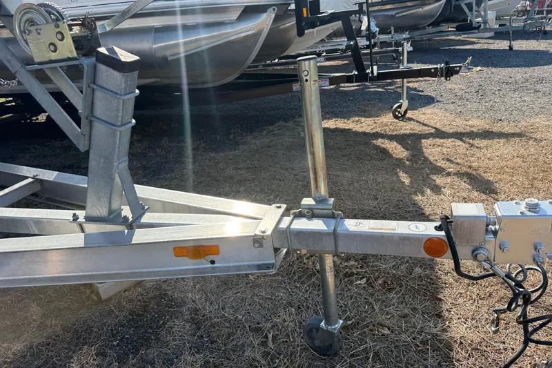 Slide: The Image of Trailer hitch and winch for 2005 Chaparral 236 SSi boat on dry grass. - 40