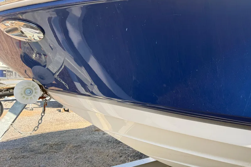 Slide: The Image of Close-up of a 2005 Chaparral 236 SSi boat hull on a trailer. - 6