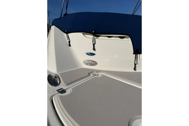 Slide: The Image of 2005 Chaparral 236 SSi boat with blue cover and logo detail. - 8