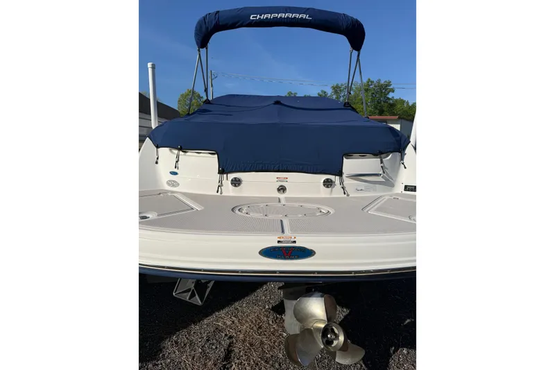 Slide: The Image of 2005 Chaparral 236 SSi boat with blue cover and visible propeller. - 9
