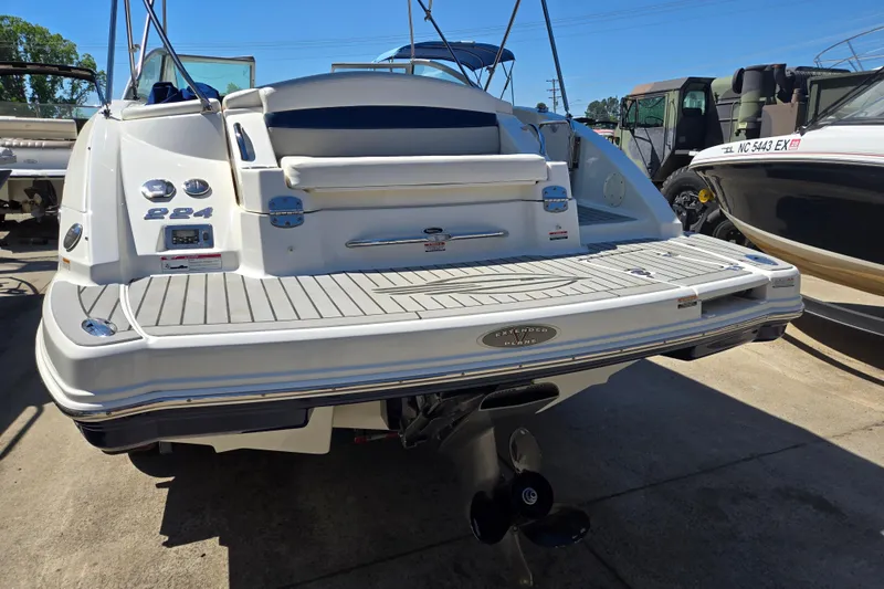 Slide: The Image of 2010 Chaparral Sunesta 224 boat rear view with extended swim platform. - 11