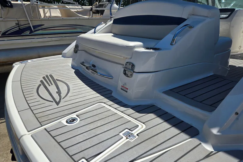 Slide: The Image of 2010 Chaparral Sunesta 224 boat deck with seating and logo detail. - 12