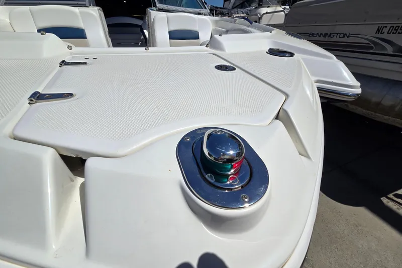 Slide: The Image of 2010 Chaparral Sunesta 224 boat deck with navigation light and seating area. - 15