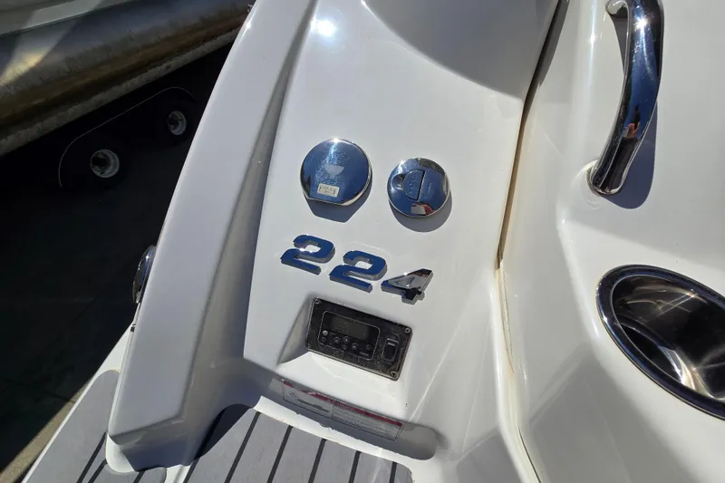 Slide: The Image of 2010 Chaparral Sunesta 224 boat stern with model number and chrome details. - 20