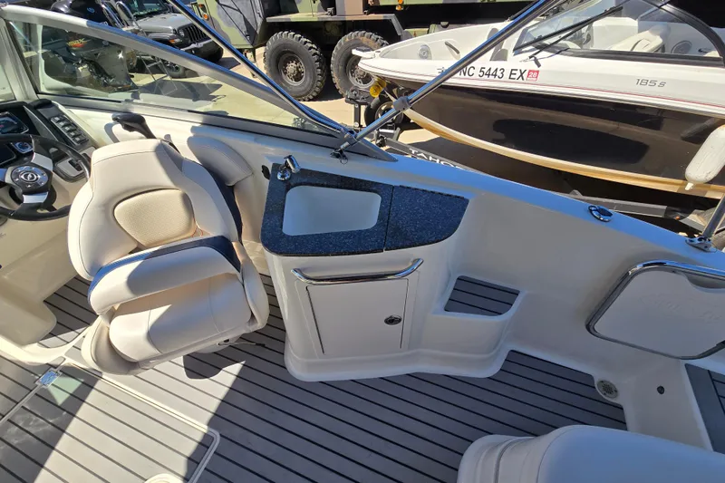 Slide: The Image of 2010 Chaparral Sunesta 224 boat interior with seating and sink area. - 24