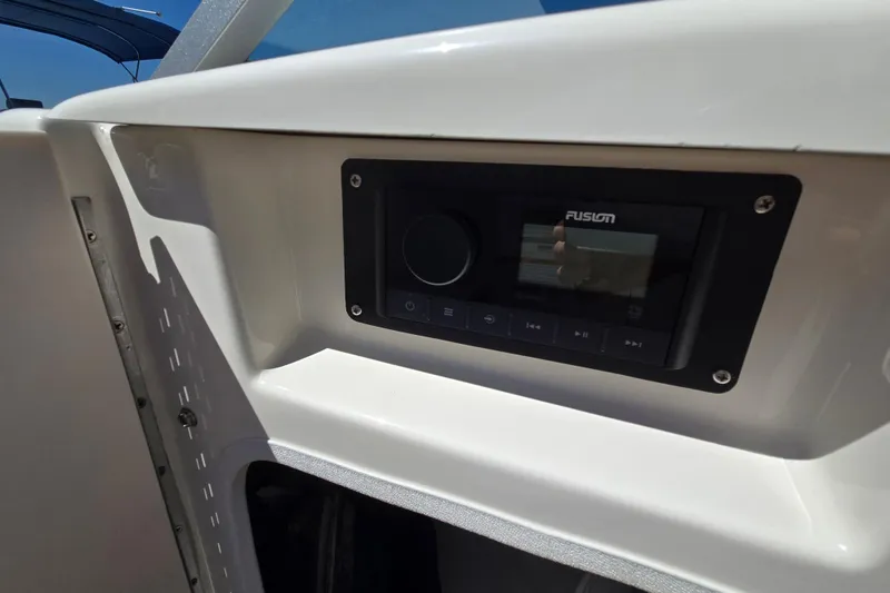 Slide: The Image of 2010 Chaparral Sunesta 224 boat dashboard with Fusion stereo system. - 34