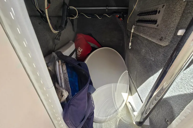 Slide: The Image of Interior storage of 2010 Chaparral Sunesta 224 boat with bags and equipment. - 40