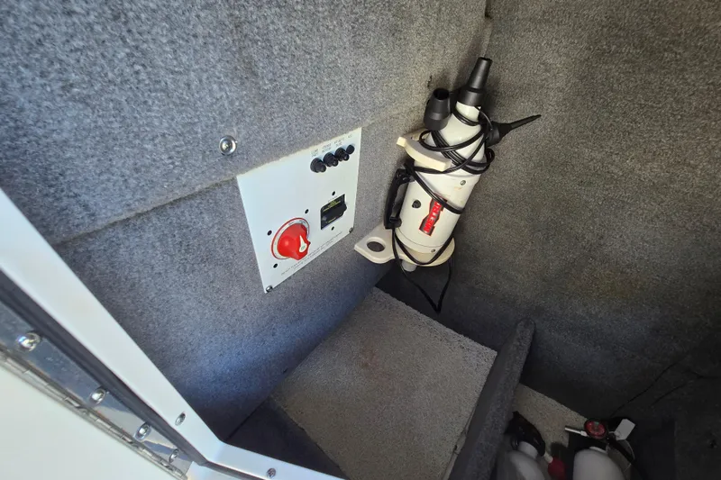 Slide: The Image of 2010 Chaparral Sunesta 224 interior showing control panel and equipment storage. - 41